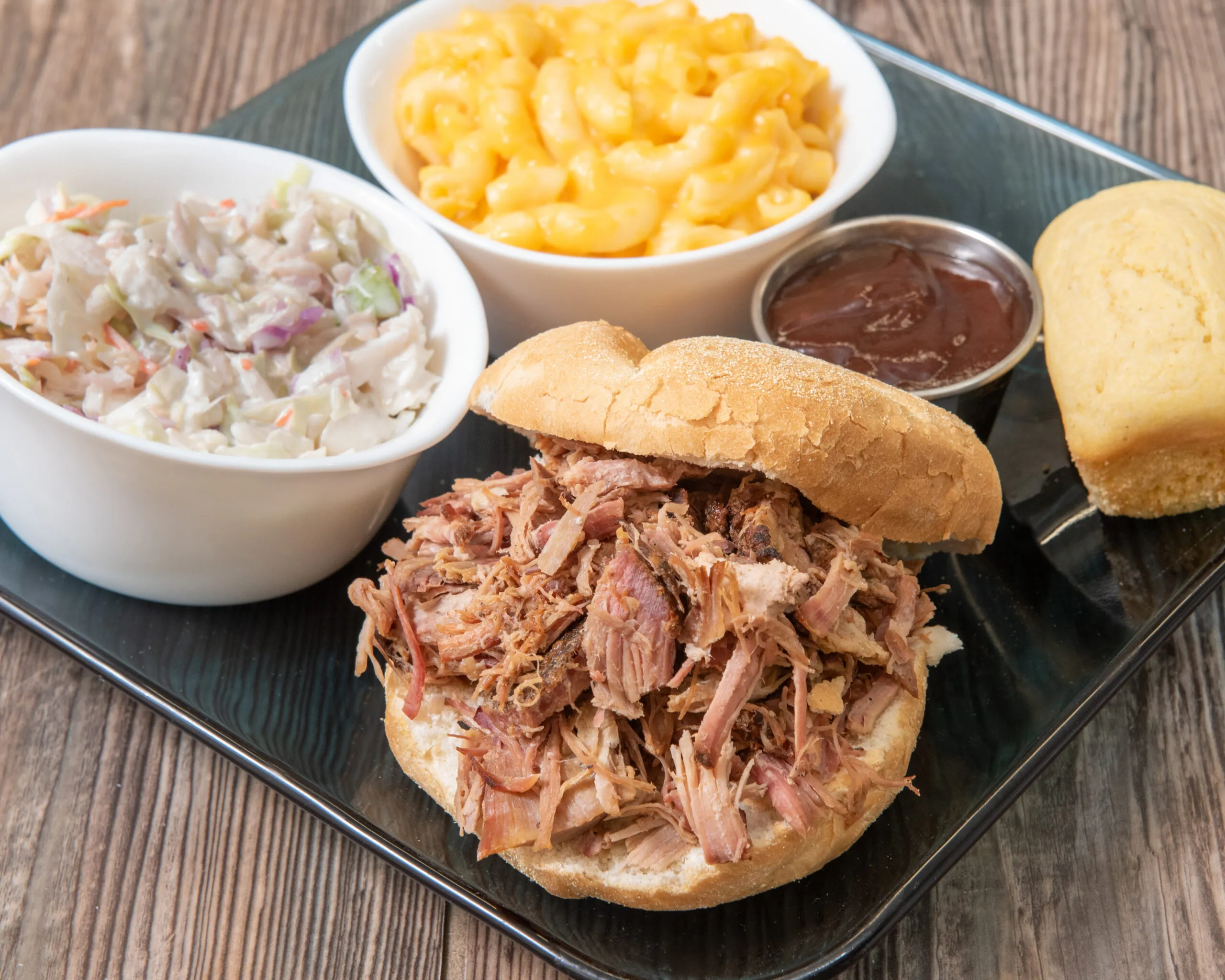 Pulled pork sandwich with coleslaw, mac and cheese and BBQ sauce at Bell's Breakaway