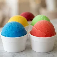 Assorted water ice flavors including blue raspberry, mango, cherry and green apple